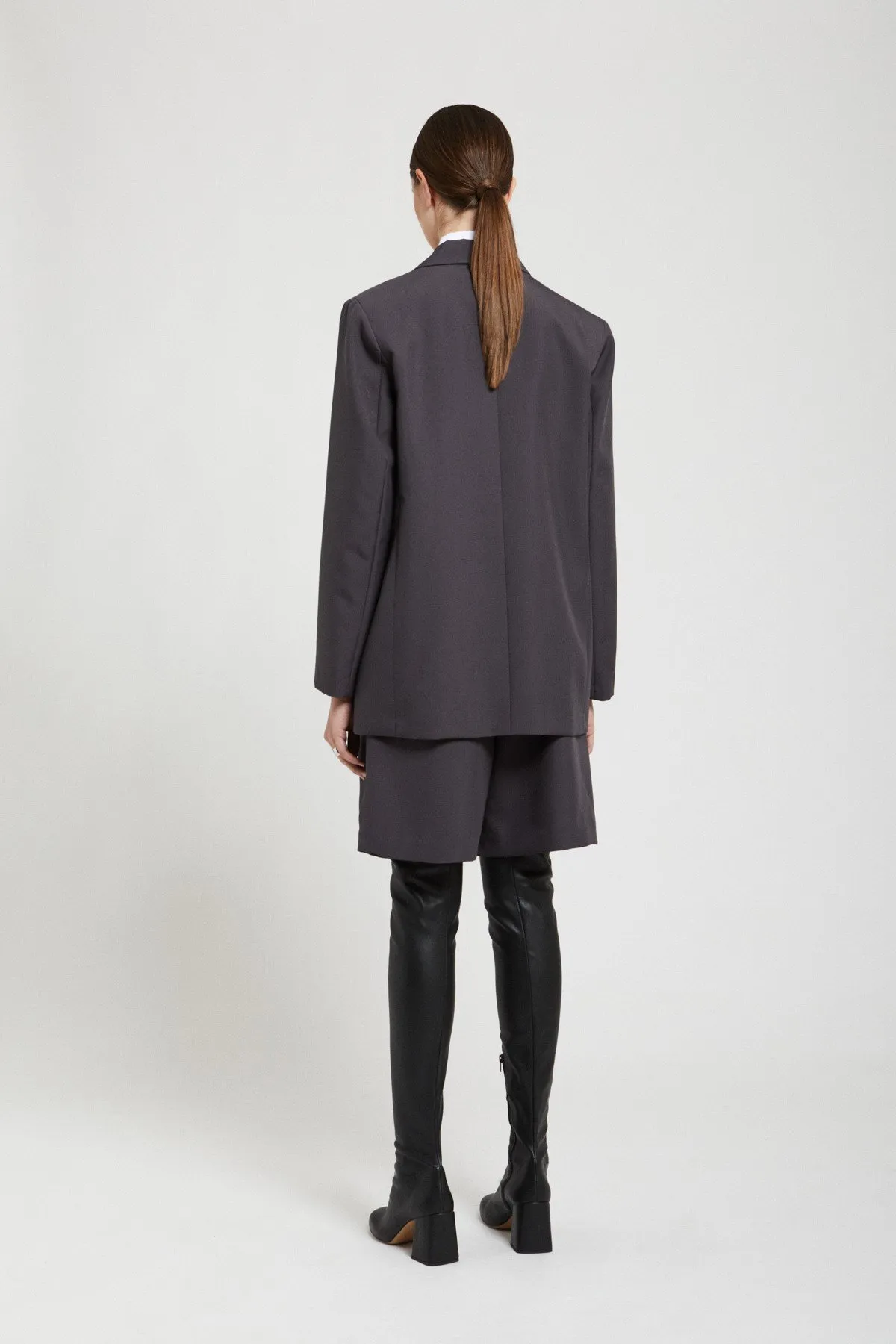 Jacket with grommet and chain