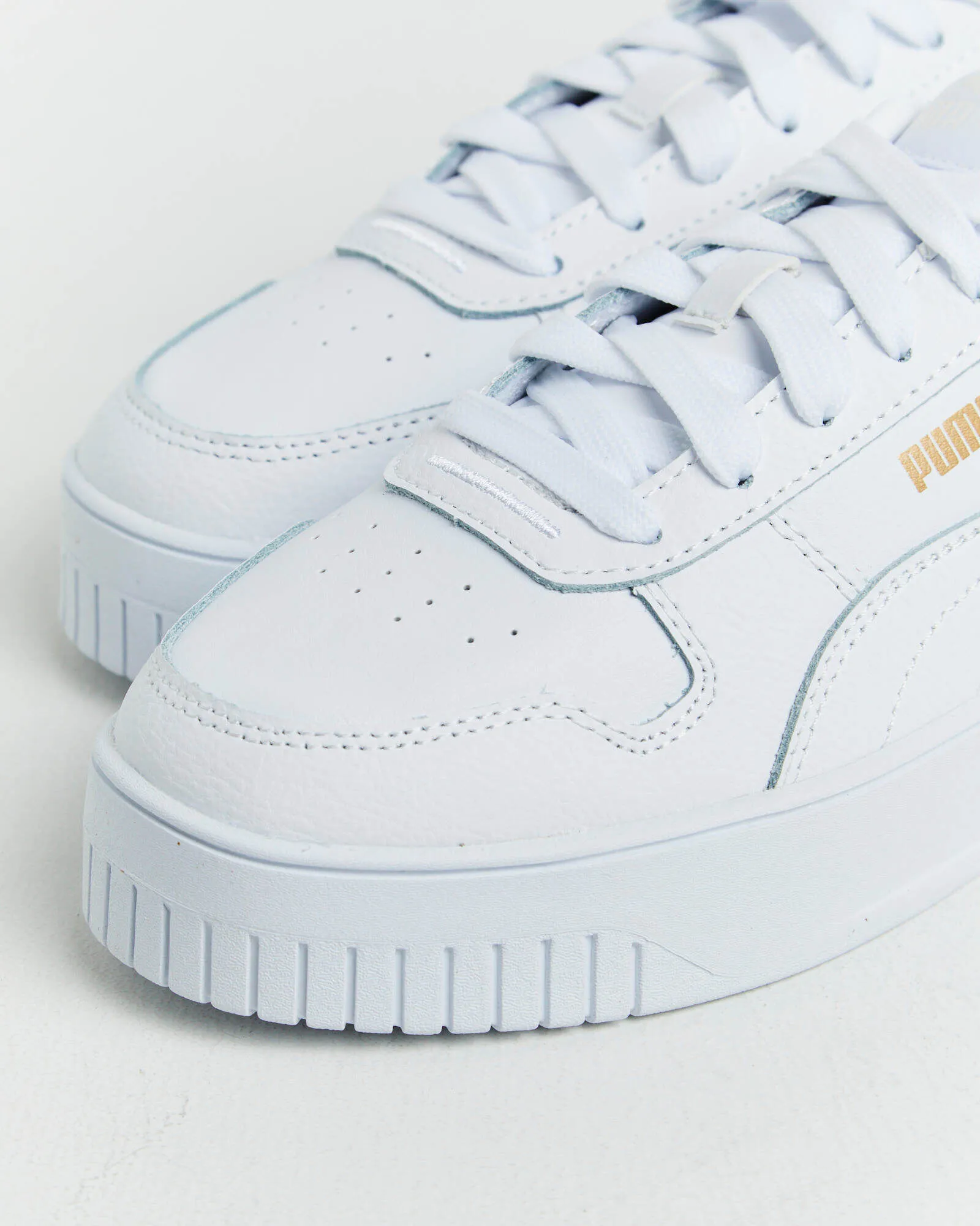 Puma Carina Street Puma Sneakers in White/Gold